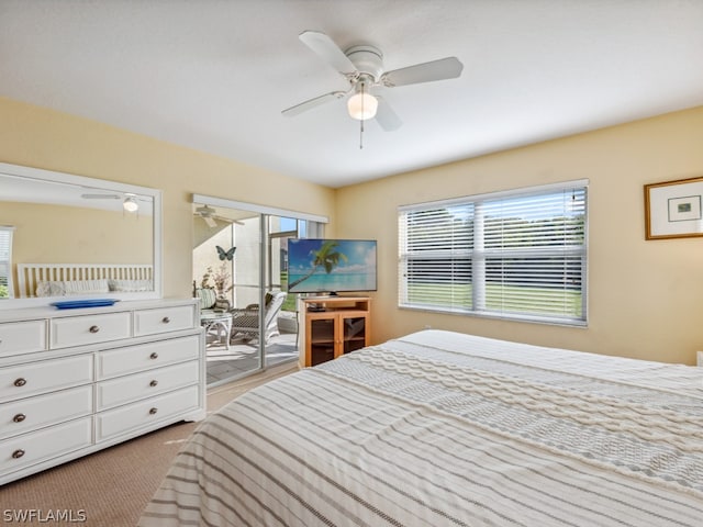 bedroom with light carpet, ceiling fan, and access to exterior