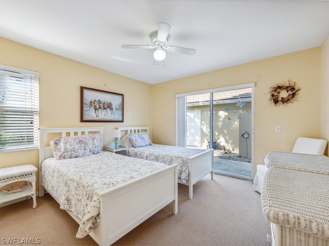 bedroom with ceiling fan, carpet, and access to outside