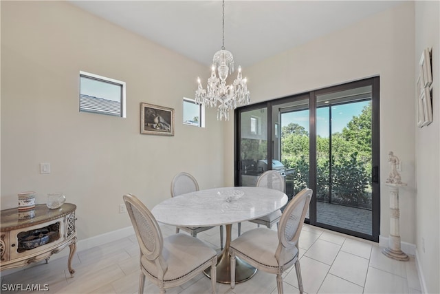 tiled dining space with an inviting chandelier