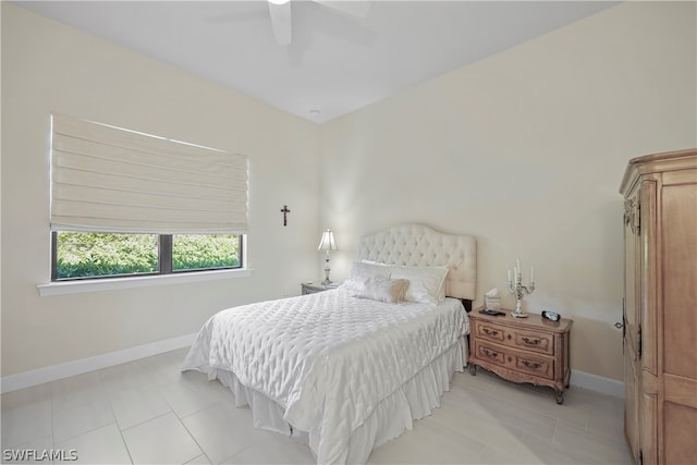 tiled bedroom featuring ceiling fan