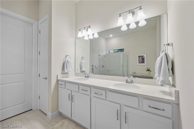 bathroom featuring walk in shower, large vanity, tile floors, and double sink