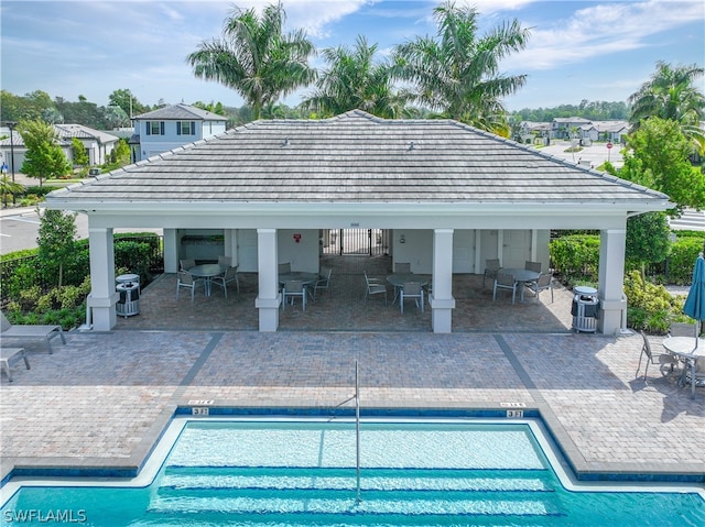 view of pool featuring a patio and a gazebo