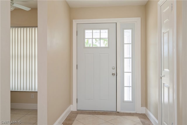 foyer entrance featuring ceiling fan and light tile floors