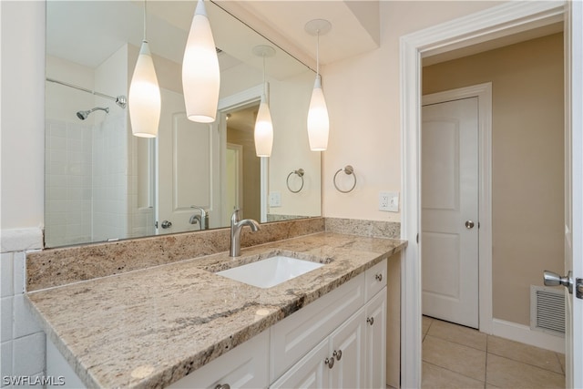 bathroom featuring large vanity and tile floors