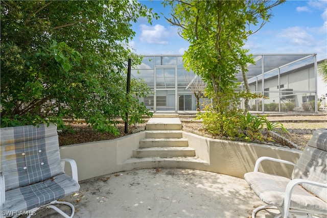 view of patio / terrace with glass enclosure