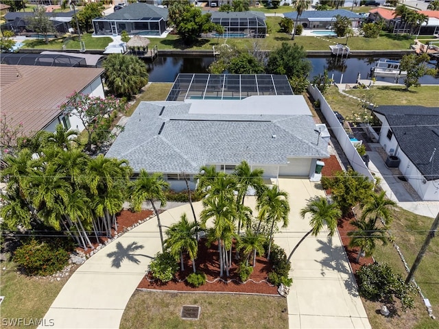 birds eye view of property with a water view