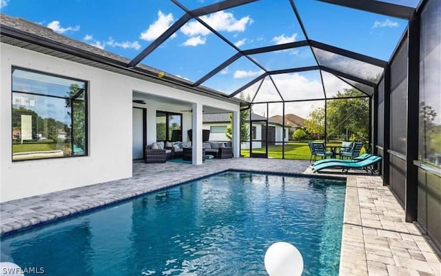 view of swimming pool with an outdoor living space, ceiling fan, a lanai, and a patio area