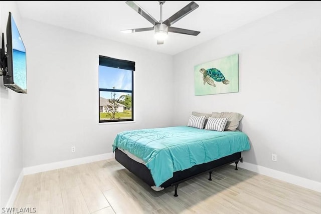 bedroom featuring light hardwood / wood-style flooring and ceiling fan