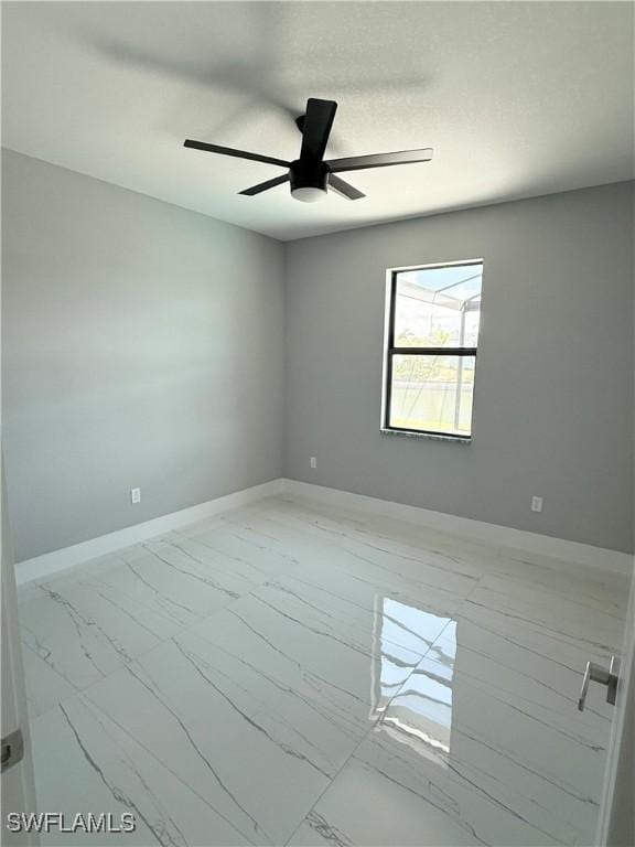 unfurnished room with ceiling fan