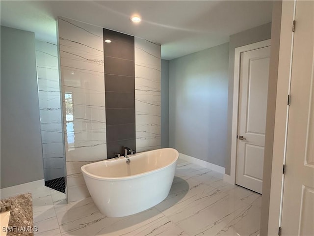 bathroom with tile walls and a washtub