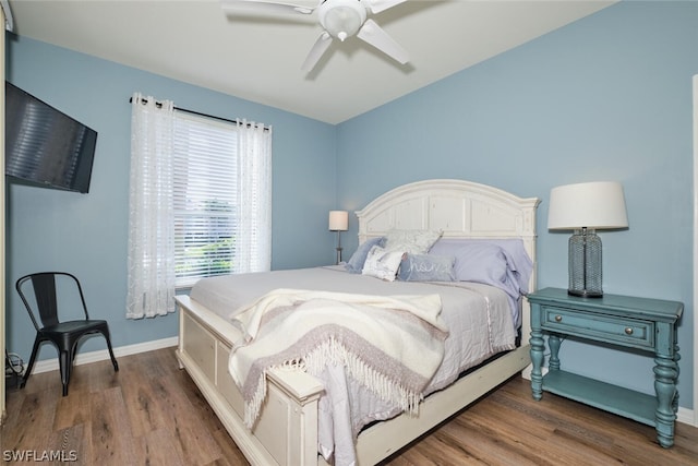 bedroom with ceiling fan and hardwood / wood-style flooring