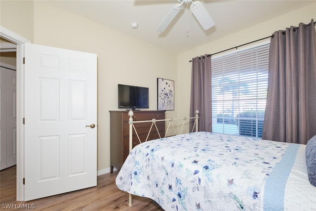 bedroom featuring hardwood / wood-style flooring and ceiling fan