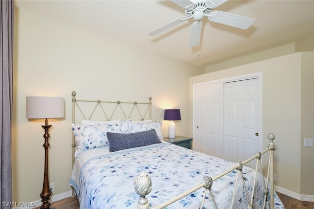 bedroom with hardwood / wood-style flooring, a closet, and ceiling fan