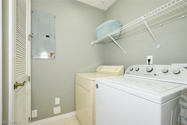 washroom with washing machine and clothes dryer