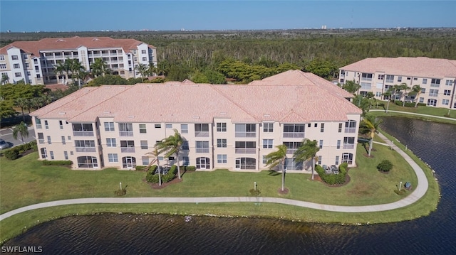 birds eye view of property featuring a water view