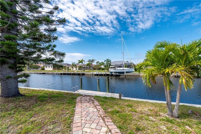 exterior space with a yard and a water view