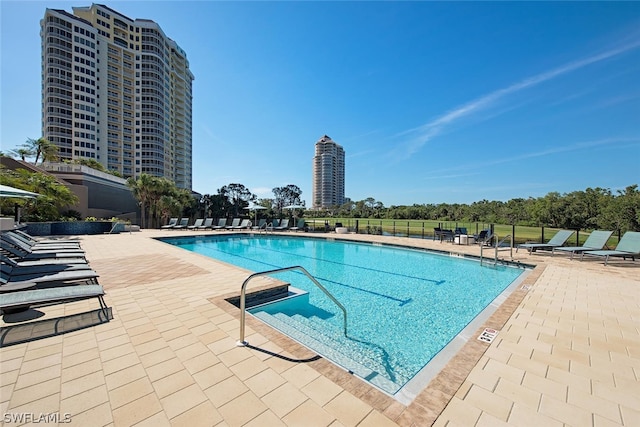 view of swimming pool with a patio