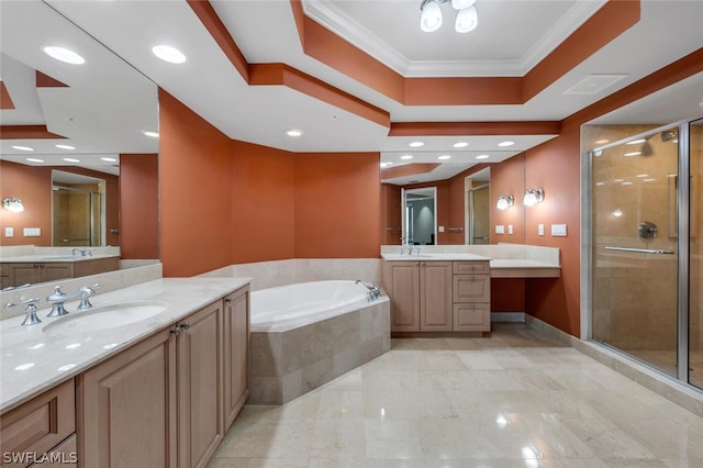 bathroom featuring crown molding, vanity, and shower with separate bathtub