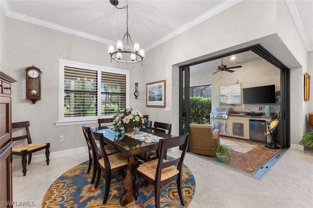 dining space featuring ceiling fan with notable chandelier and ornamental molding