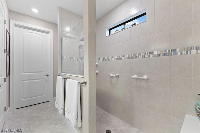 bathroom with a tile shower