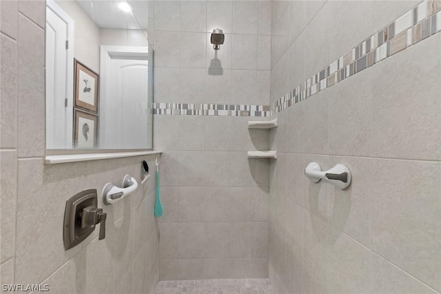 bathroom with tiled shower