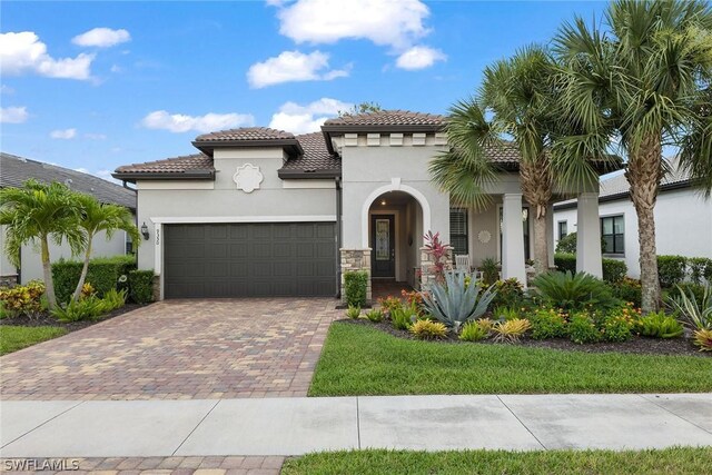 mediterranean / spanish house with a garage