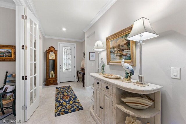 entrance foyer with french doors and ornamental molding