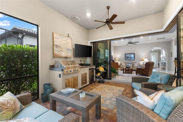 living room with ceiling fan