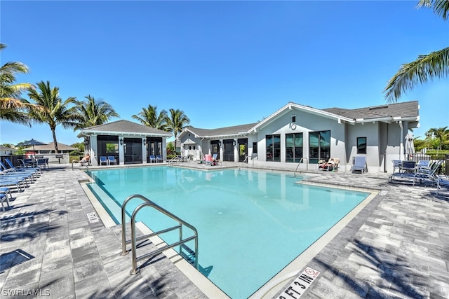 view of swimming pool featuring a patio area