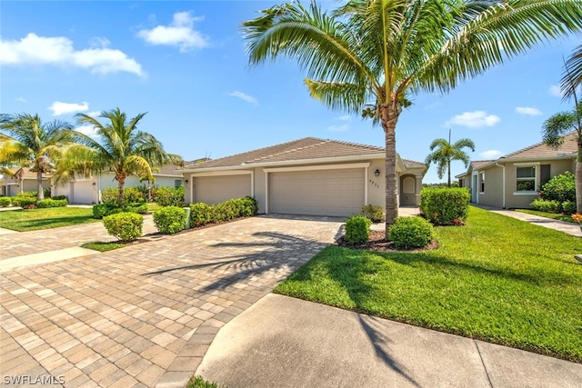 view of front facade with a garage and a front yard