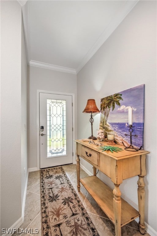 foyer with crown molding and tile floors