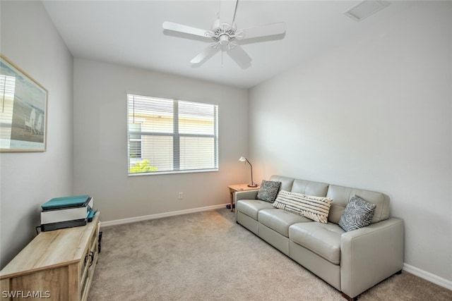 carpeted living room featuring ceiling fan