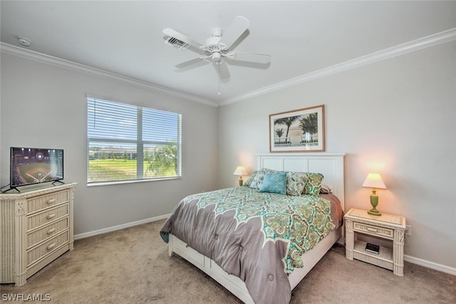 carpeted bedroom featuring ceiling fan and ornamental molding