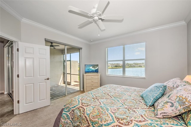 bedroom featuring a closet, ceiling fan, carpet flooring, and crown molding