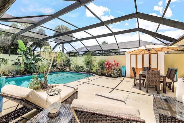 view of pool featuring a patio and glass enclosure