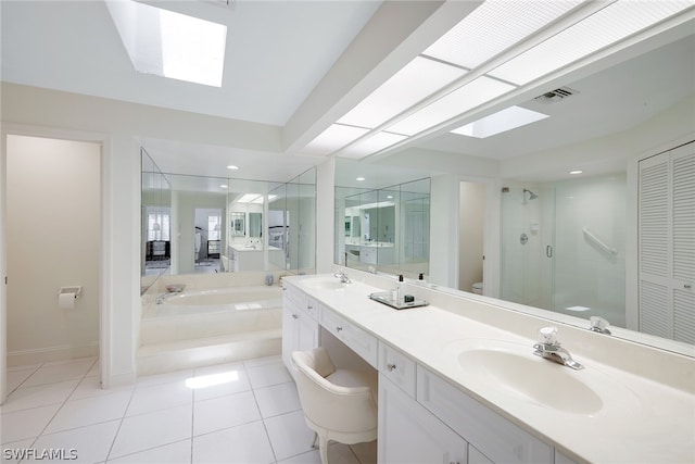 full bathroom featuring tile floors, double sink, oversized vanity, toilet, and plus walk in shower