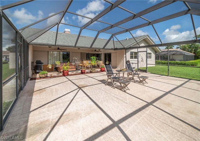 unfurnished sunroom with ceiling fan