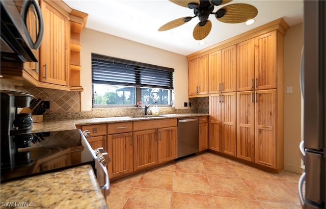 kitchen with appliances with stainless steel finishes, ceiling fan, light tile floors, sink, and backsplash