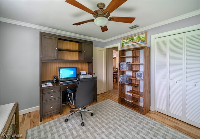 office space featuring ornamental molding, light hardwood / wood-style floors, and ceiling fan