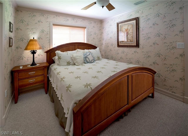 bedroom with ornamental molding, ceiling fan, and carpet flooring