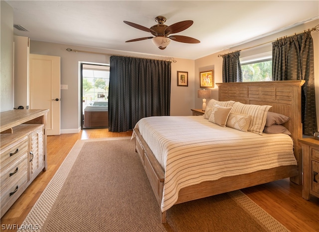 bedroom with ceiling fan and light wood-type flooring