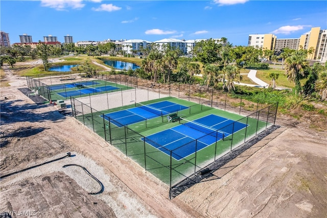 view of sport court with a water view