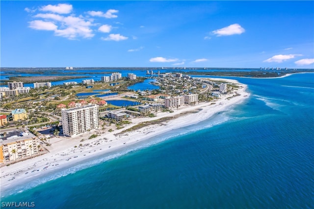 bird's eye view featuring a water view and a beach view