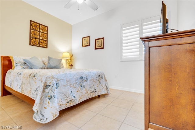 bedroom featuring ceiling fan and light tile floors