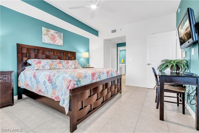 tiled bedroom with ceiling fan