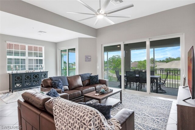 tiled living room with ceiling fan