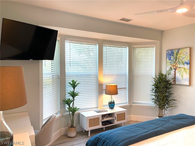 bedroom featuring ceiling fan and hardwood / wood-style floors