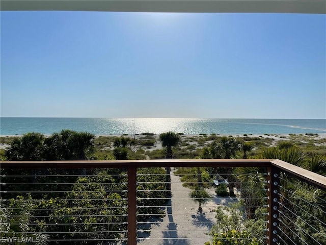 exterior space featuring a water view and a view of the beach