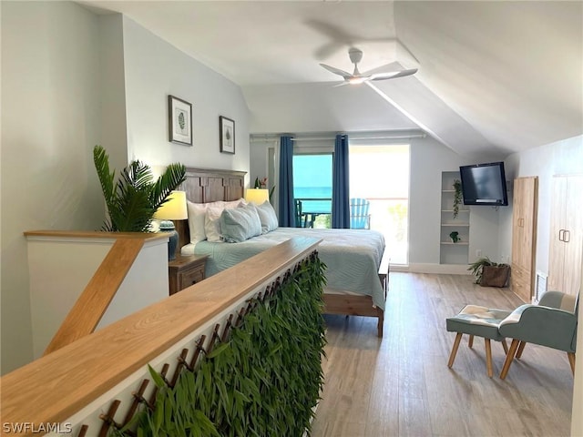 bedroom featuring lofted ceiling, light hardwood / wood-style flooring, and ceiling fan