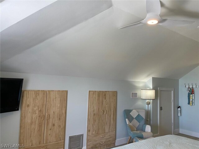 bedroom featuring ceiling fan and lofted ceiling